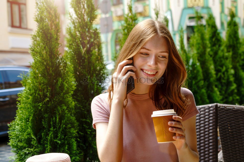 Similar – Image, Stock Photo Girl sitting in a street bar looking at her smartphone