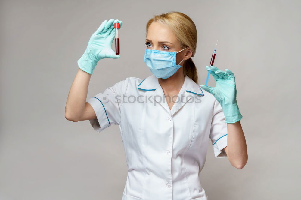 Similar – portrait of doctor woman wearing protective mask and gloves indoors. Using mobile phone. Corona virus concept