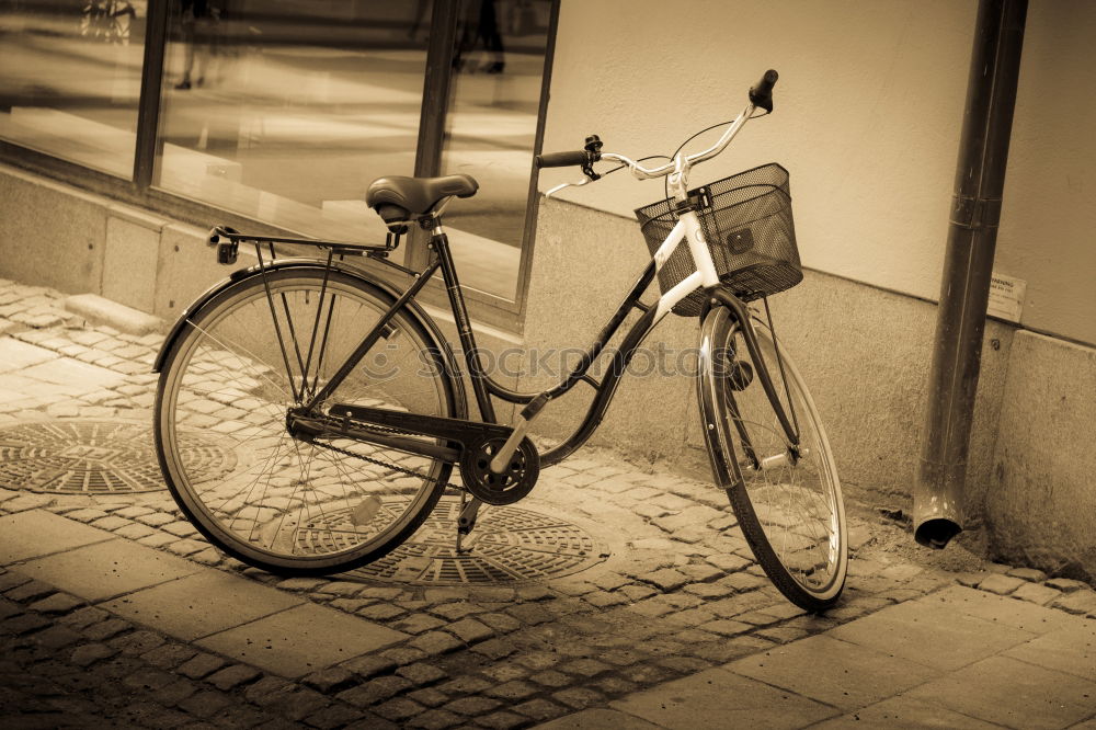 Similar – Altes, kaputtes Fahrrad liegt auf dem Gehweg