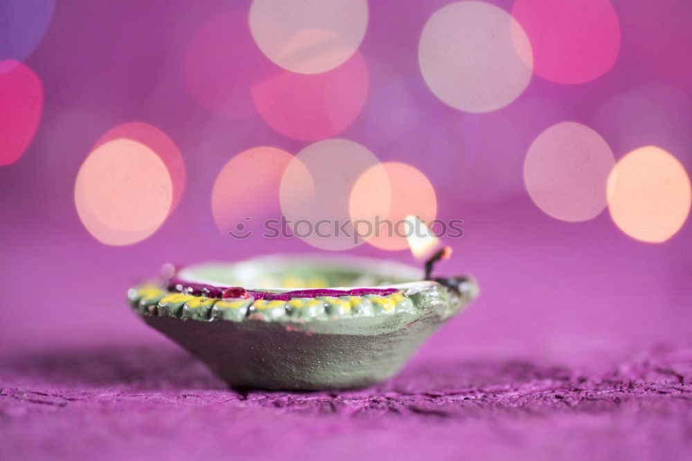 Similar – Lit candle isolated on a pink background. Aromatic pink candle burning