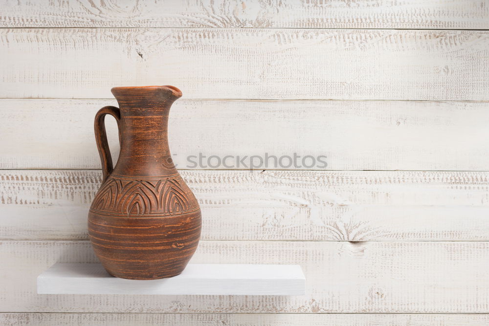 Similar – set of rustic cutting boards and ceramic brown vase