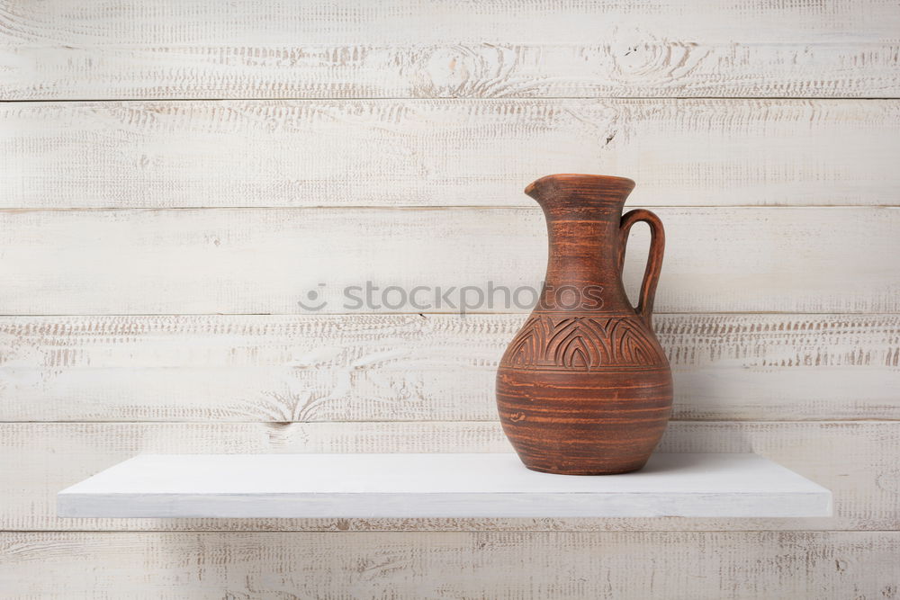 Similar – set of rustic cutting boards and ceramic brown vase