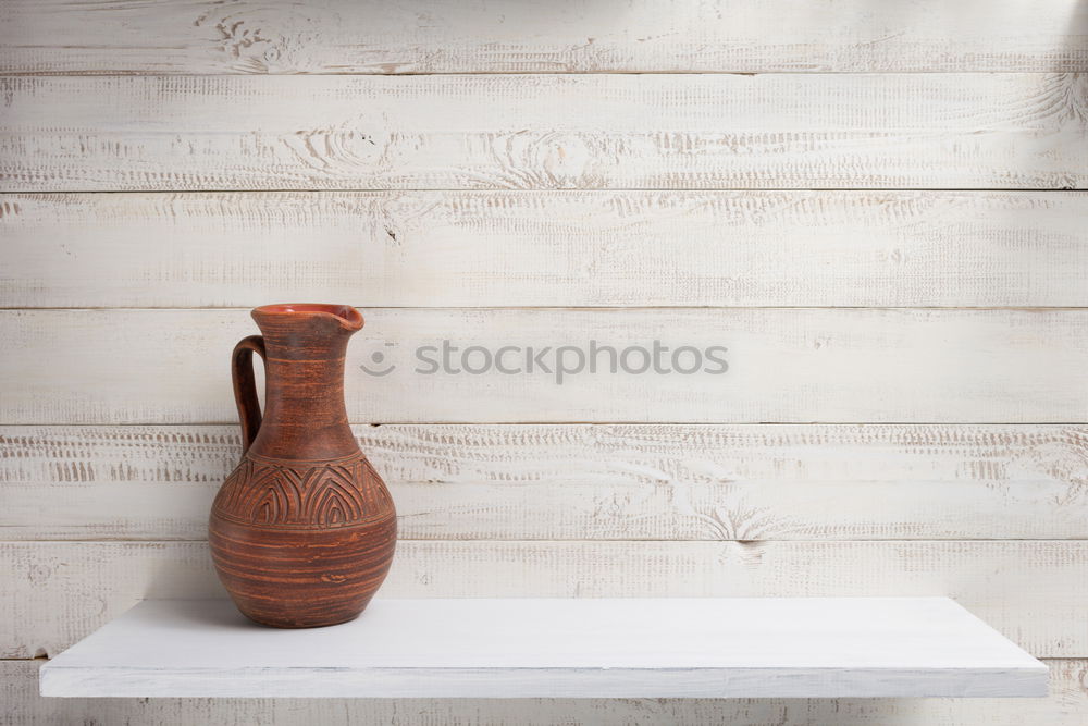 Similar – set of rustic cutting boards and ceramic brown vase