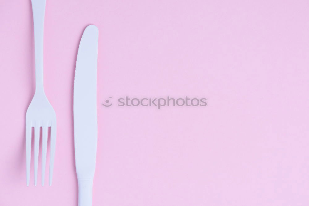 Similar – Disposable colorful plastic dish, straws and cups, cutlery. Flat lay on pink background.