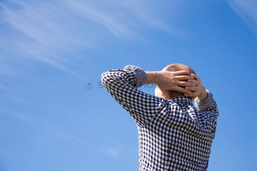 Similar – Man exhausted from a hike at a viewpoint