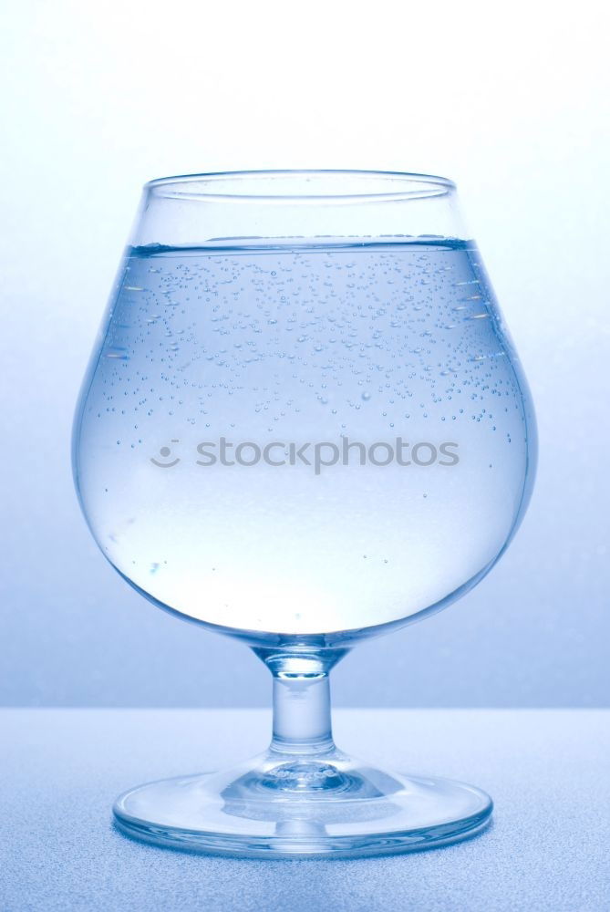 Similar – Minimalist photo of glass of clean drinking water on blue background