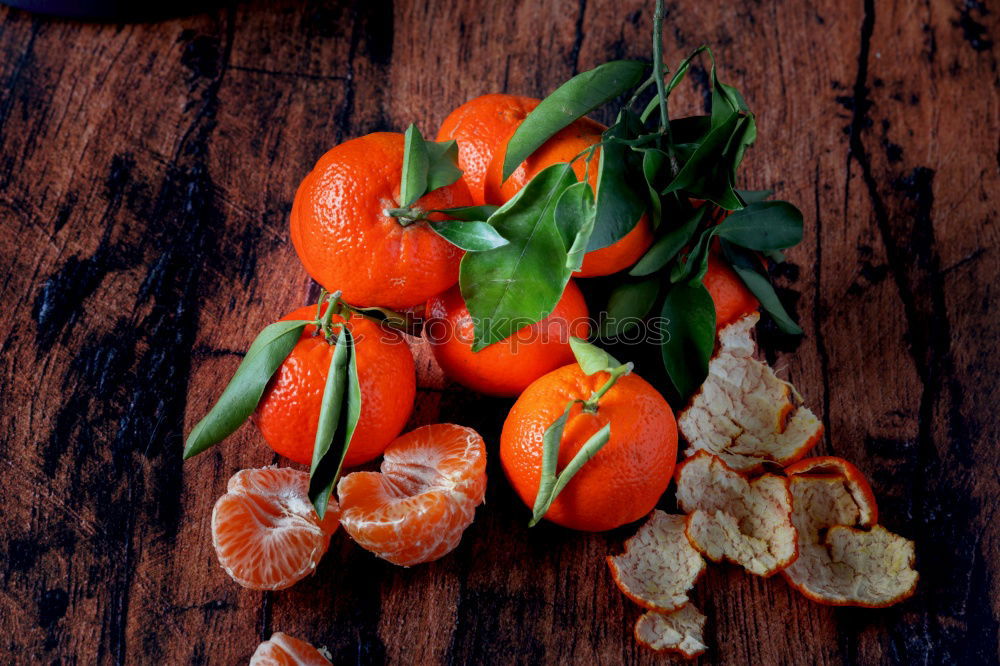 Similar – Image, Stock Photo Whole and peeled mandarins with leaves