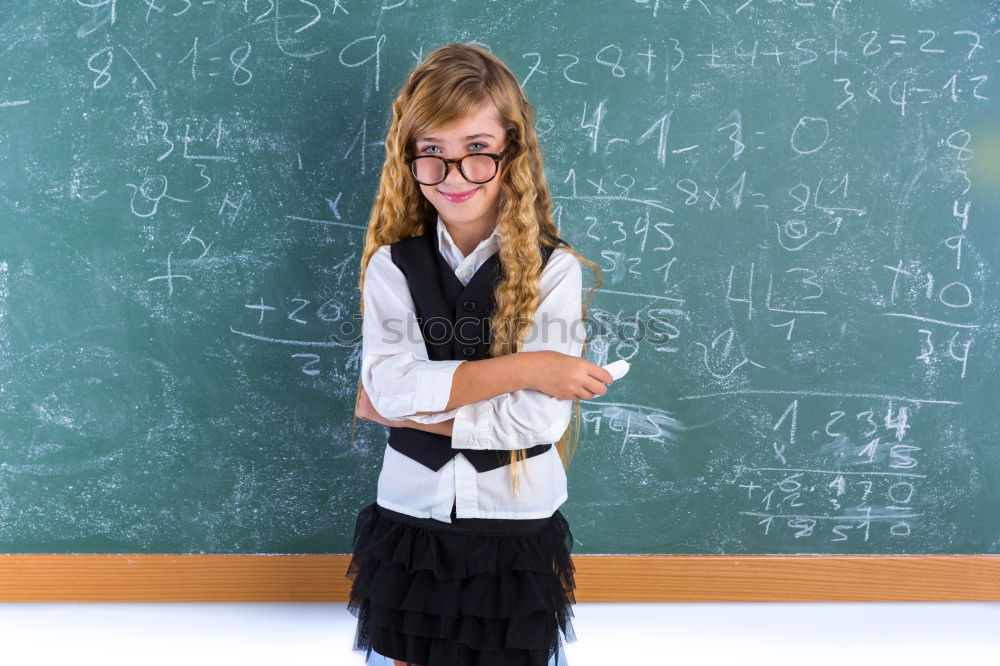 Similar – Pupil writing on the blackboard