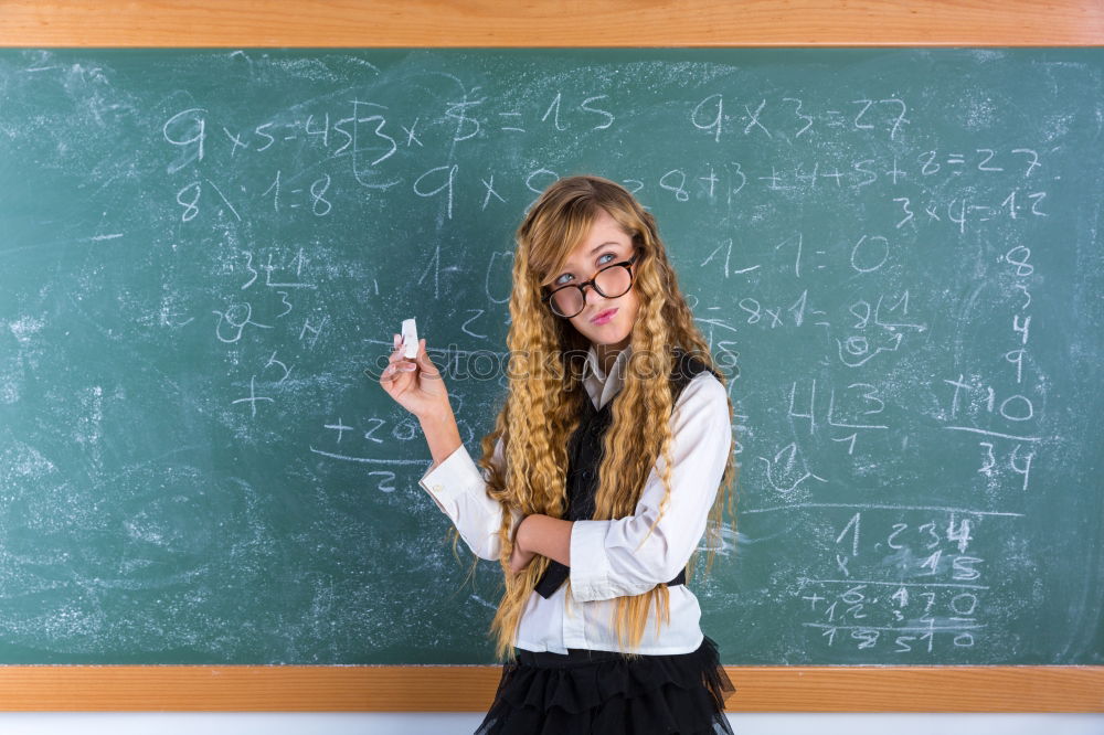 Pupil writing on the blackboard