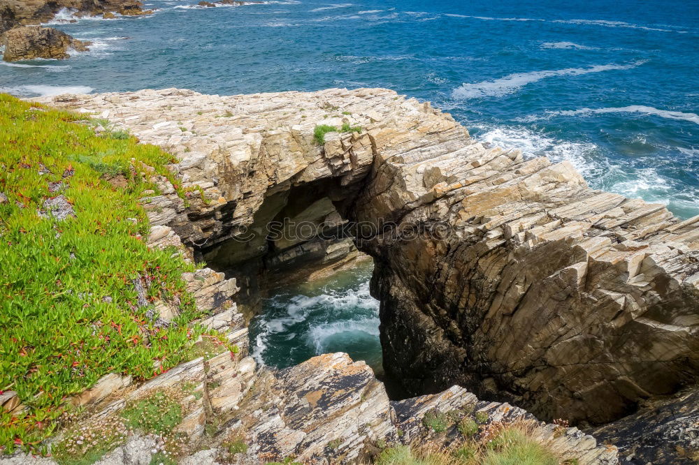 Similar – Woman sitting on cliff edge