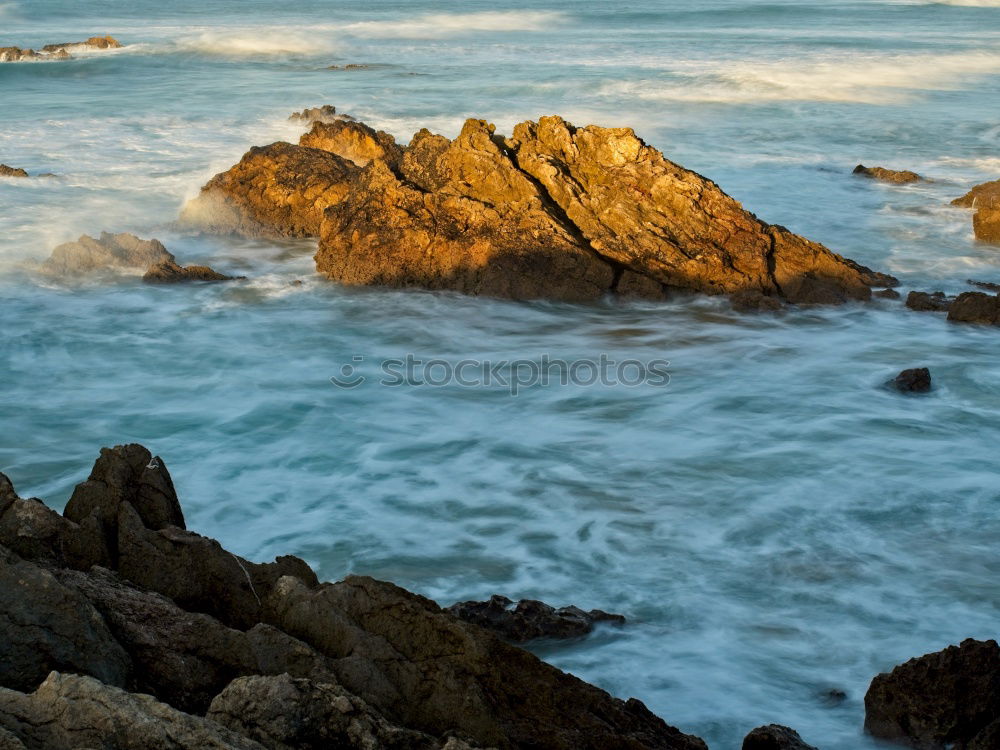 Similar – Rocks with spray in sunset in Portugal