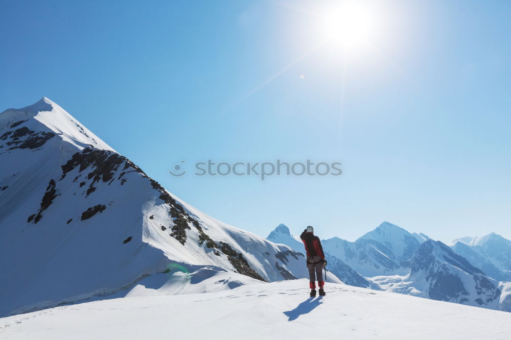 Similar – Image, Stock Photo Mountaineer at the top of a snowy mountain