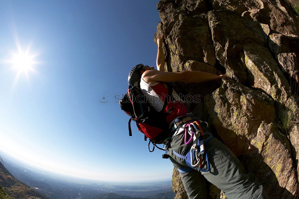 Similar – Image, Stock Photo Male rock climber clinging to a steep cliff.