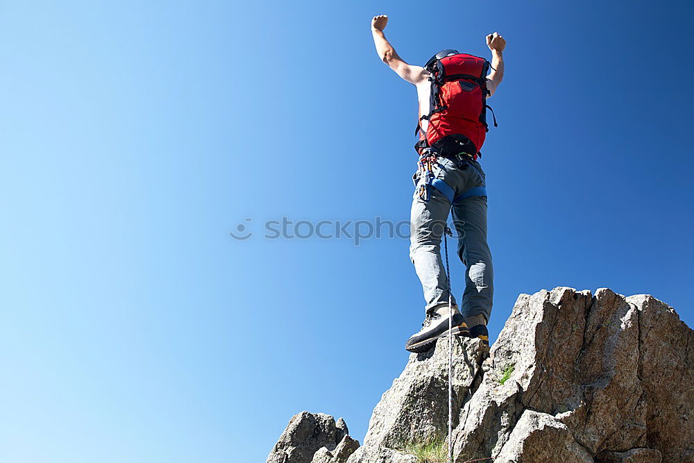 Similar – Rock climber falling upside down.