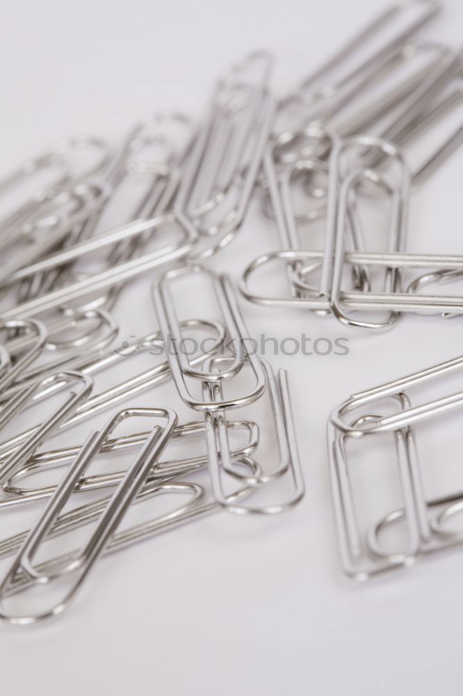 Similar – many paperclips on yellow background