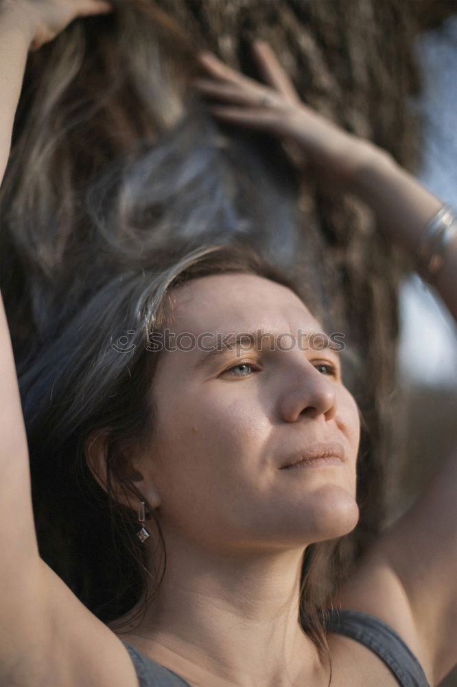 Similar – Woman posing on twigs of dry trees