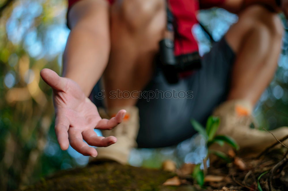 Similar – Hiker closing his partner’s backpack