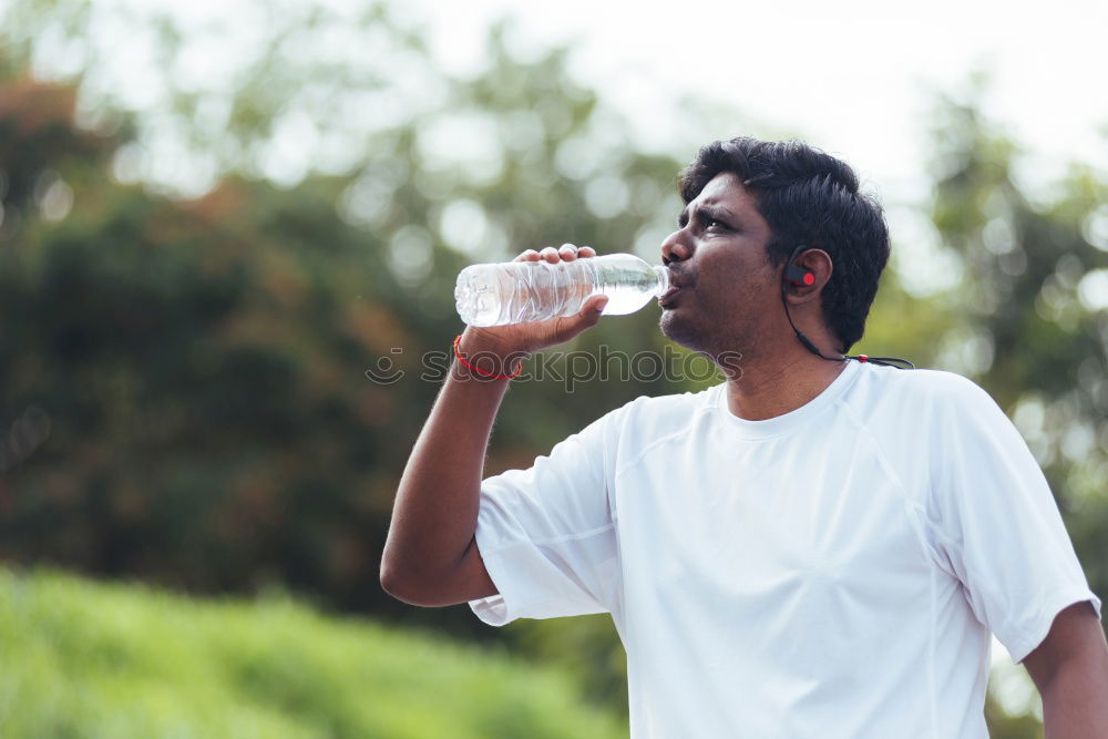 Similar – Image, Stock Photo Young black man drinking water before running outdoors