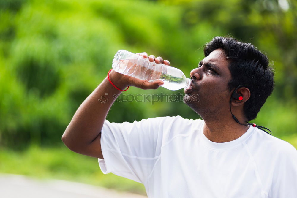 Similar – Image, Stock Photo Young black man drinking water before running outdoors