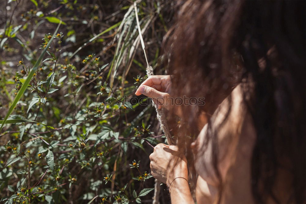 Similar – Woman posing on twigs of dry trees