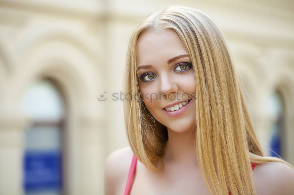 Young woman smiling in urban background.