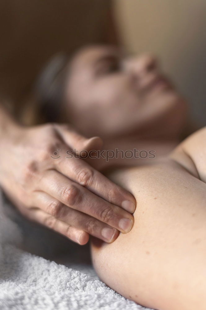 Similar – Back massage with oil and hot stones