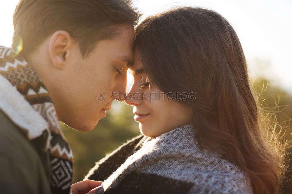 Similar – Woman with gift box in hand embracing and kissing to boyfriend