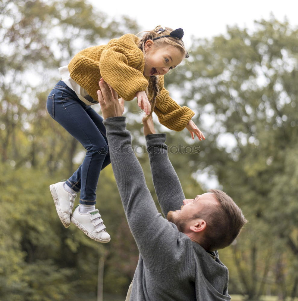 Similar – Image, Stock Photo dad holds his daughter in his arms