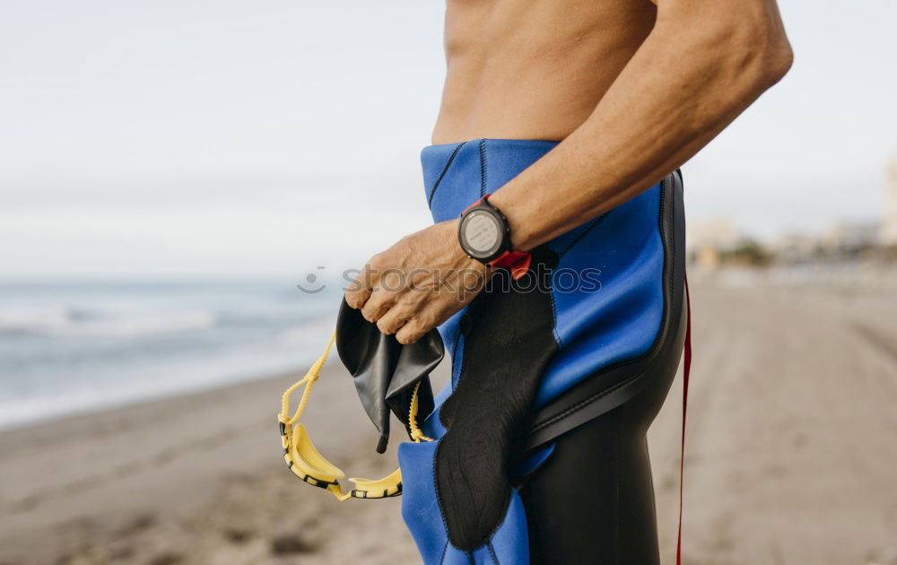 Similar – handsome swimmer putting on goggles