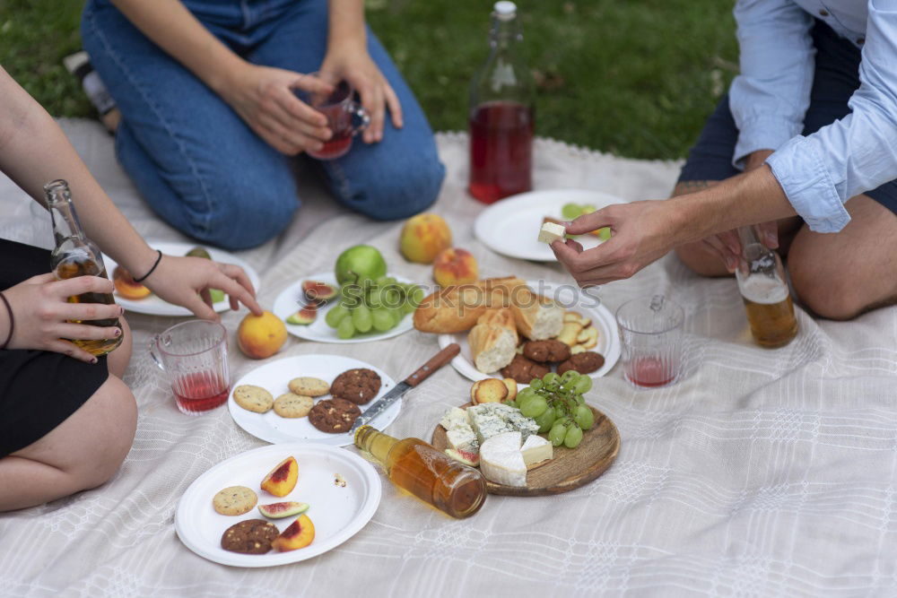 Similar – Group of People enjoying food and wine at restaurant