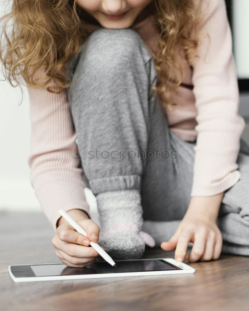 Similar – Image, Stock Photo Little girl doing homework on bed at home