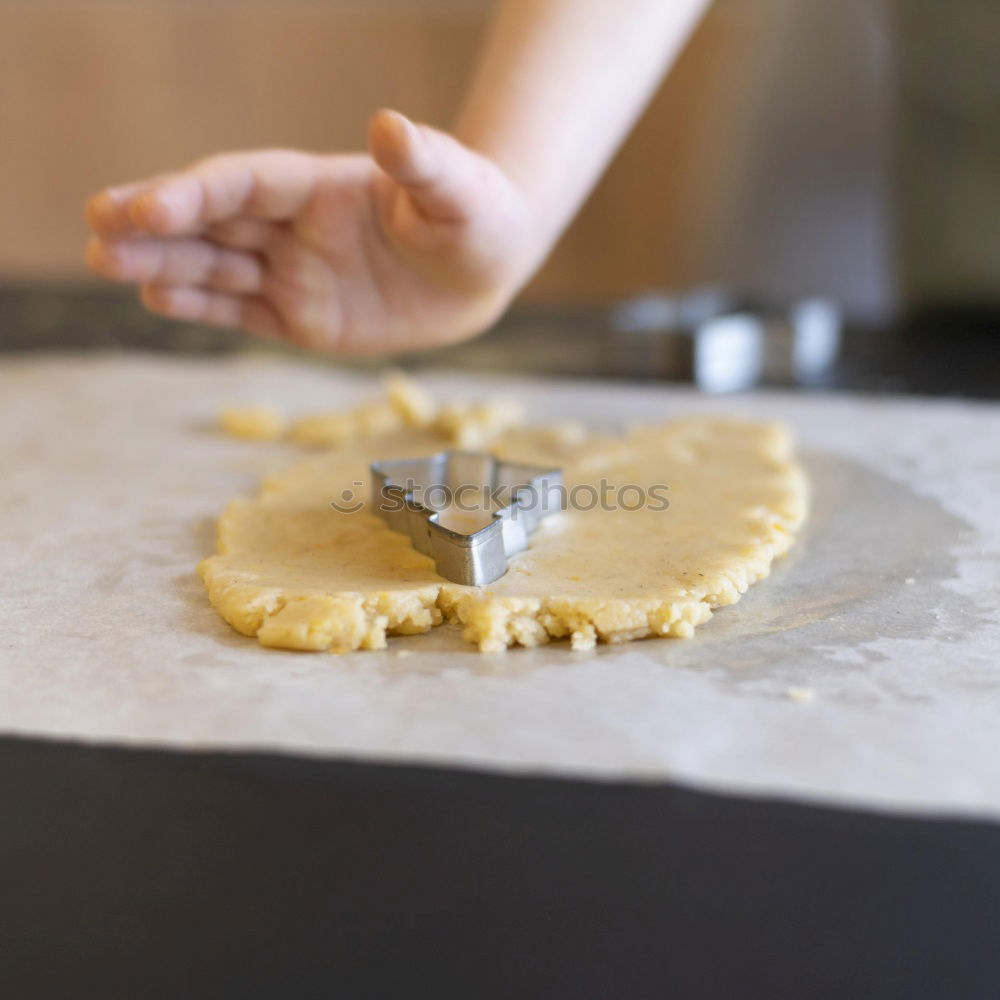 Similar – woman in bakery preparing sweets adding egg