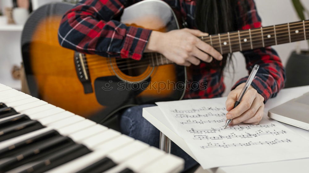 Image, Stock Photo Man playing guitar and composing music at home near a bright window on a sunny day. Casual musician sitting on the floor playing the guitar.