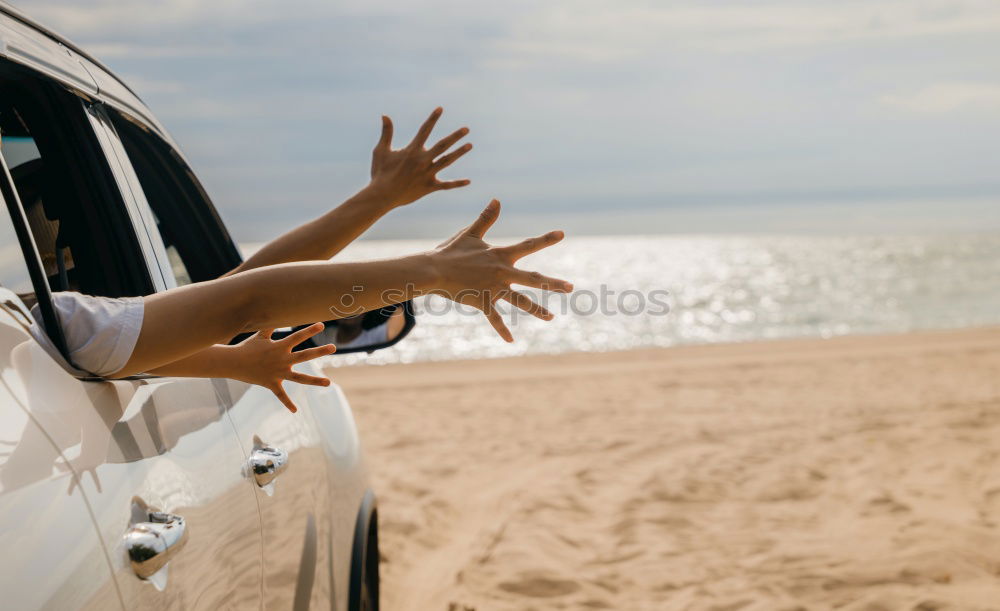 Similar – Unrecognizable man resting feet up sitting on the car