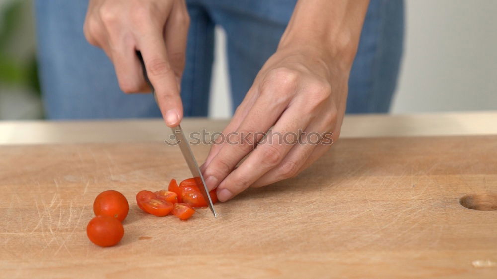 Similar – Girl tying baked Christmas gingerbread cookies with ribbon