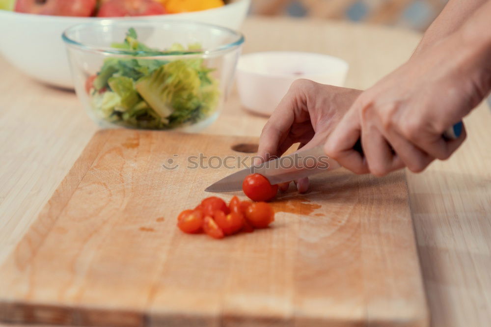 Similar – female human hand holding three large orange carrot