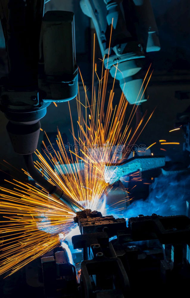 Similar – worker using an angle grinder