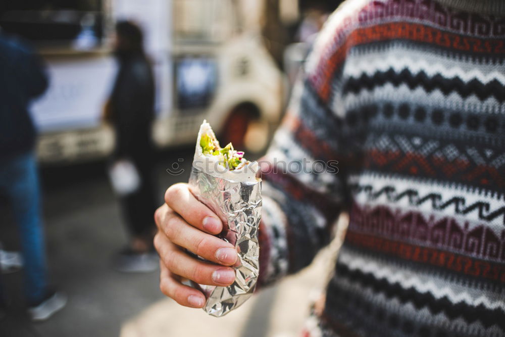 Crop woman eating sushi