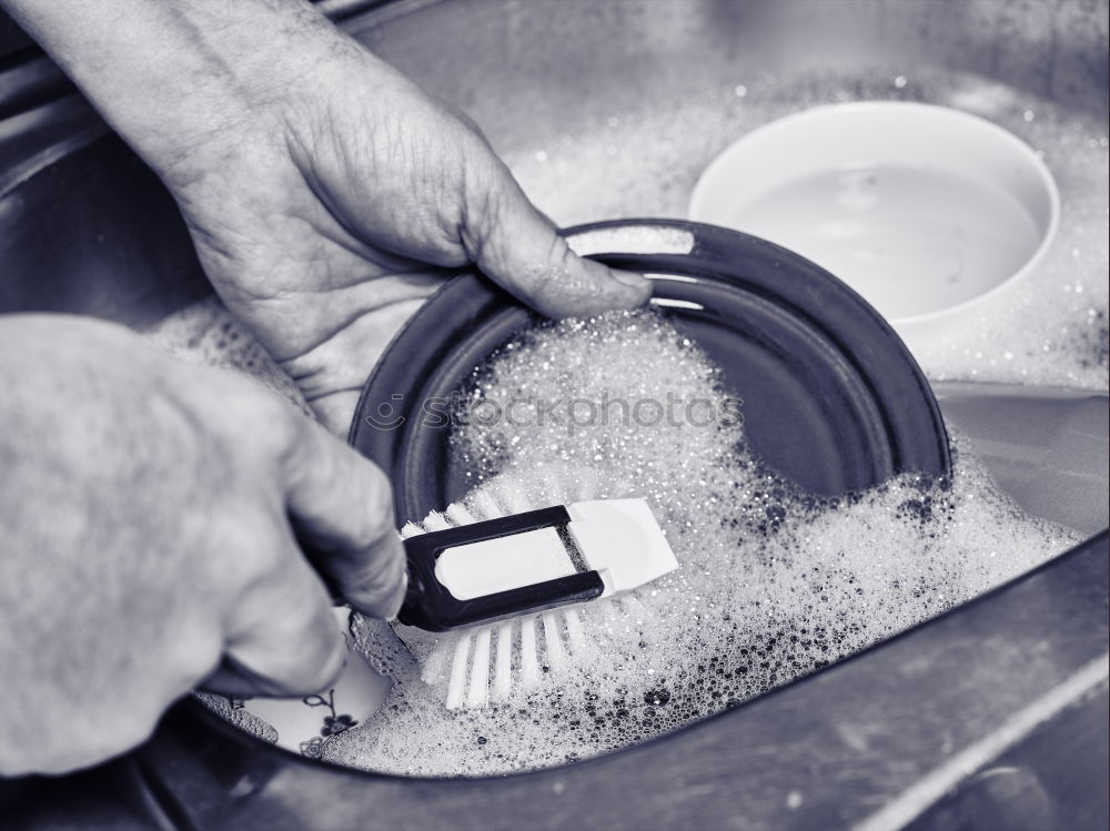 Similar – Hands of woodcarver make wooden bowl