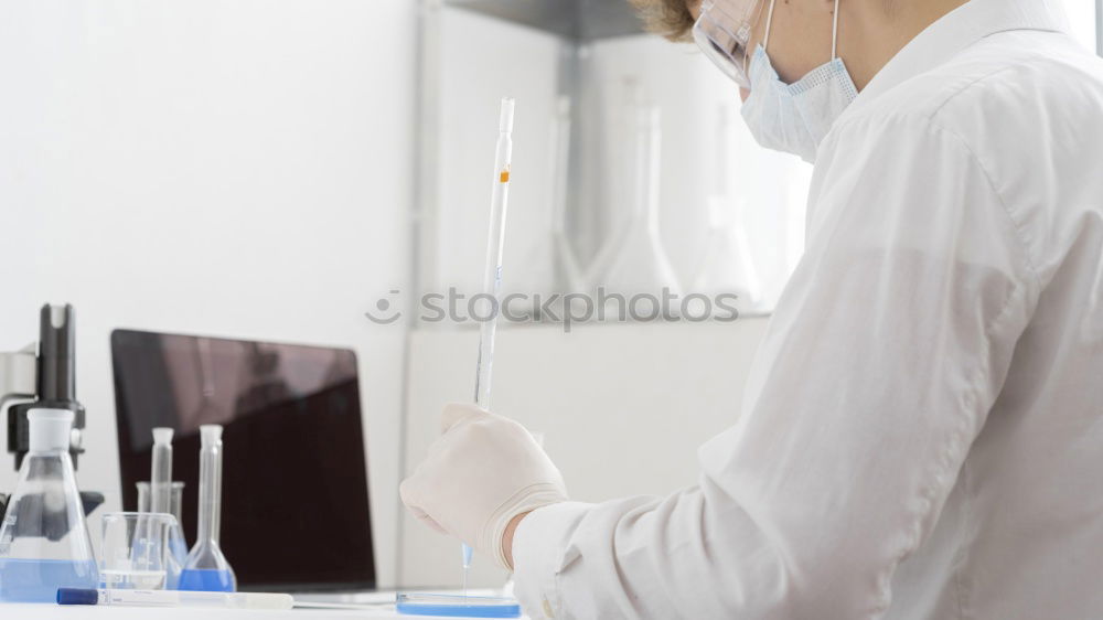 Similar – Image, Stock Photo Woman holding flask in lab