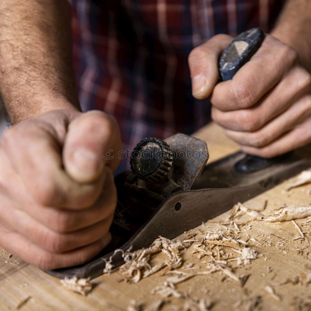 Similar – Artisan sanding and shaping wood