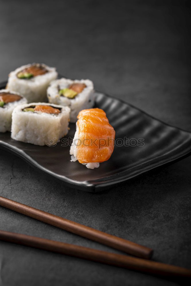 Image, Stock Photo Sushi maki rolls and sashimi on a wooden background