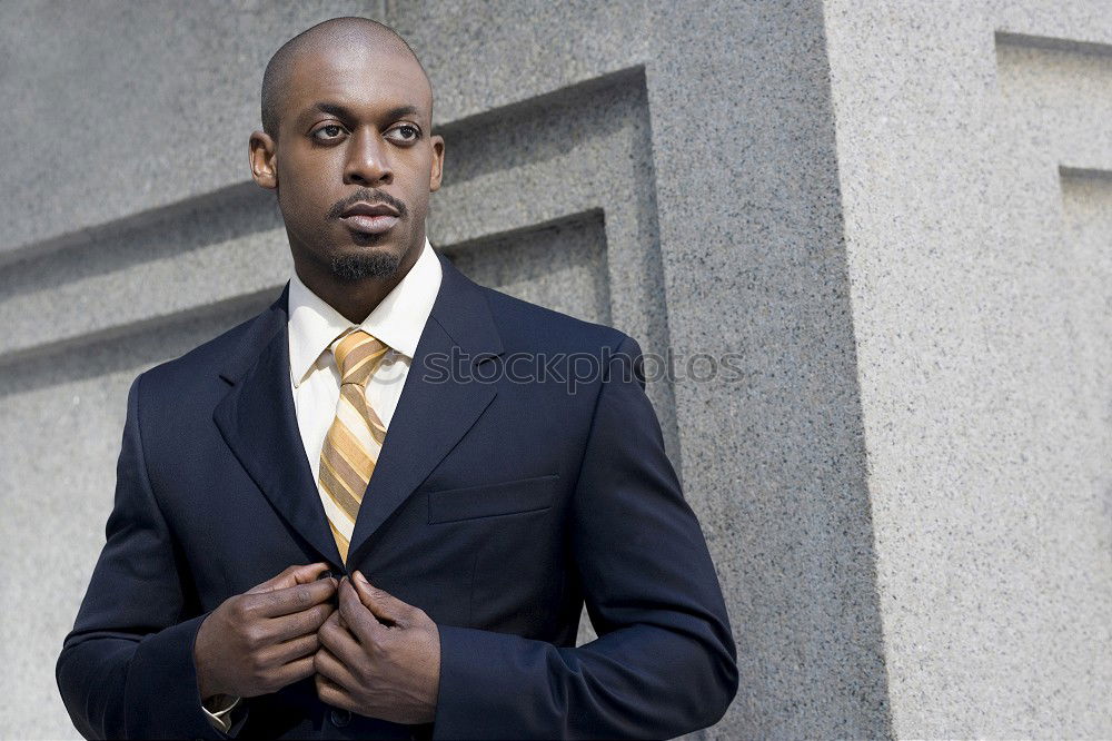 Similar – Handsome black man wearing suit in urban background