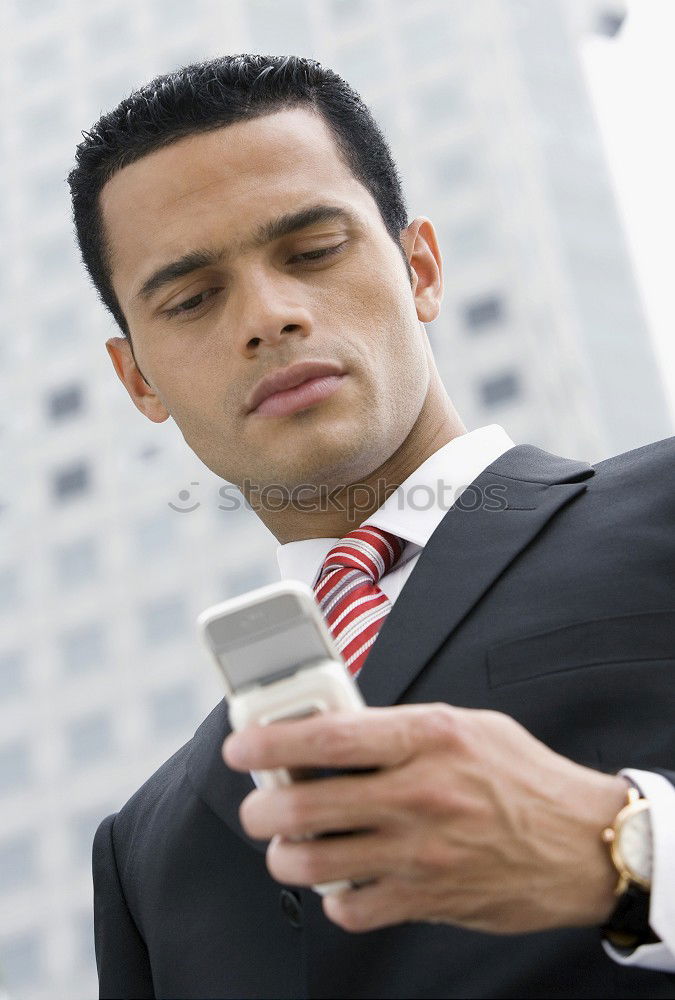 Similar – Image, Stock Photo Businessman Texting on his Phone in the Street