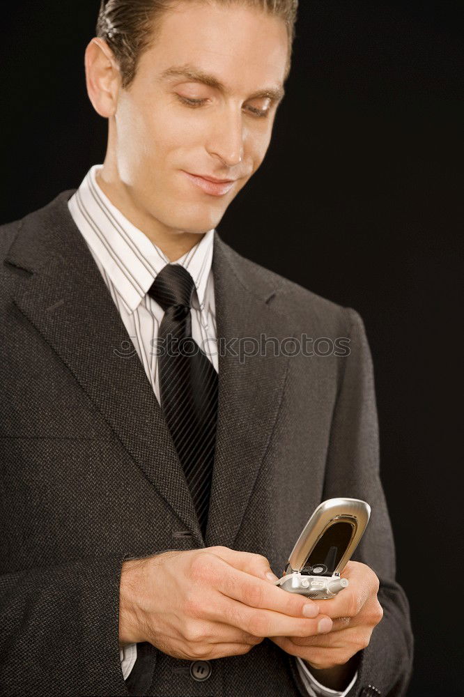 Similar – Image, Stock Photo Elegant Young Businessman in the Street Using a Mobile Phone