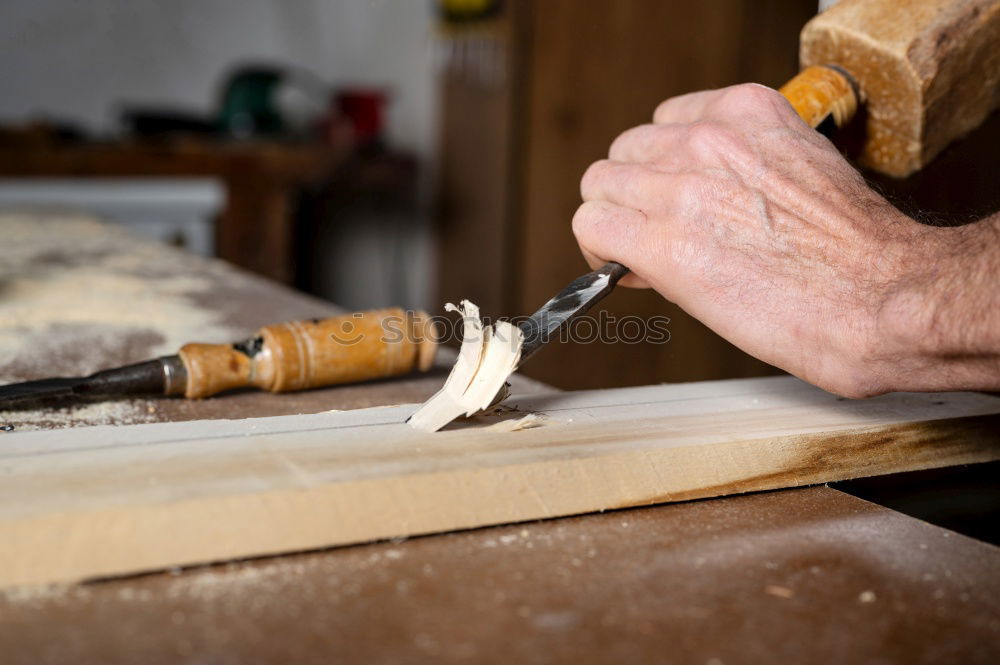 Similar – Craftsman working in his workshop wooden boxes