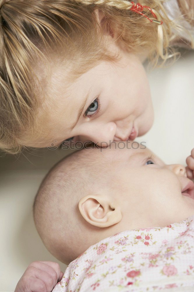 Similar – Woman playing with little happy baby on bed