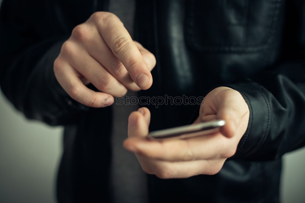 Similar – Tattooed man using a smartphone