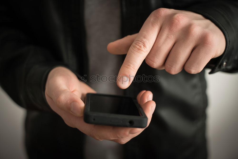 Similar – Tattooed man using a smartphone