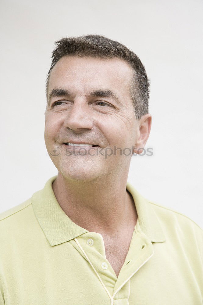 Similar – Portrait of a smiling senior with grey hair and grey beard in front of a grey sky